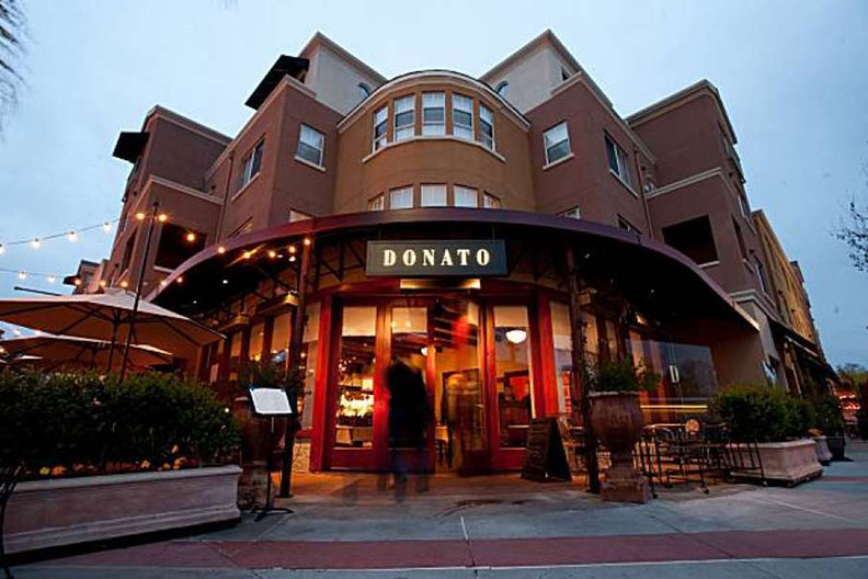 A photo of the entrance of Donato Enoteca restaurant in Redwood City, California.