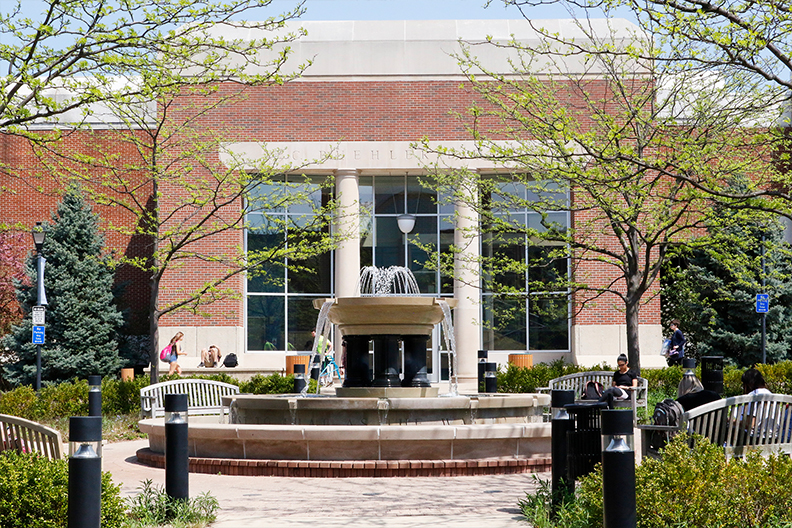 The Alumni Circle Fountain and A.C. Buehler Library on the campus of Elmhurst University in Elmhurst, IL.