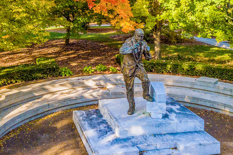 Statue of Reinhold Niebuhr in Kranz Forum on the campus of Elmhurst University in Elmhurst, IL.