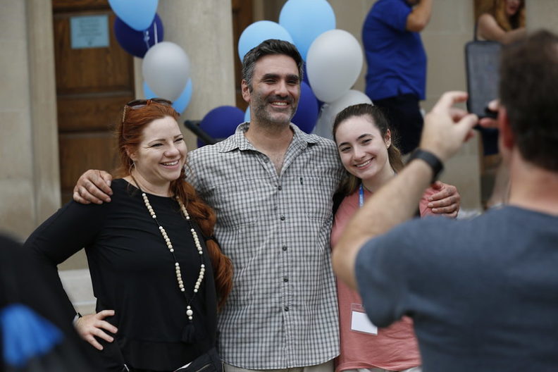 The parents of an Elmhurst University student pose for a family photo during New Student Orientation.