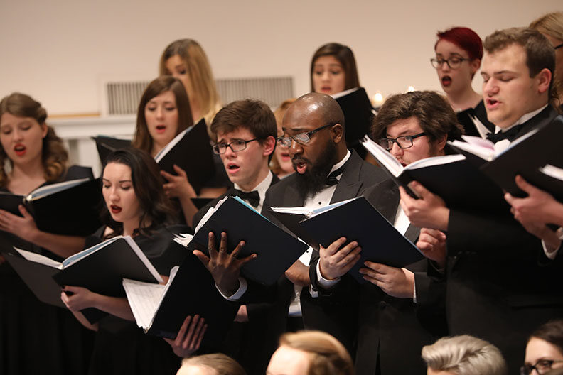 Elmhurst University choir members sing during the annual Festival of Lessons and Carols.