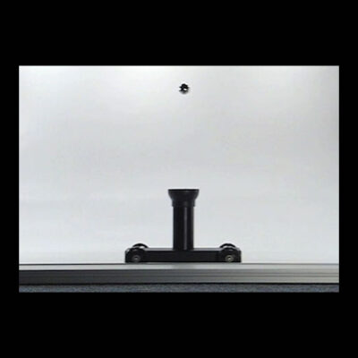 A picture of a black projectile cannon and a small silver ball above it.