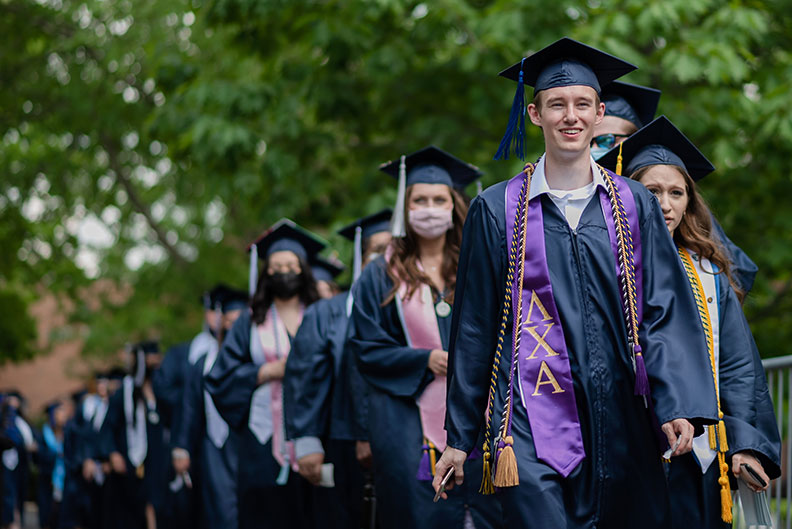 A line of Elmhurst University graduates is seen during the procession into the 2021 Commencement ceremony.