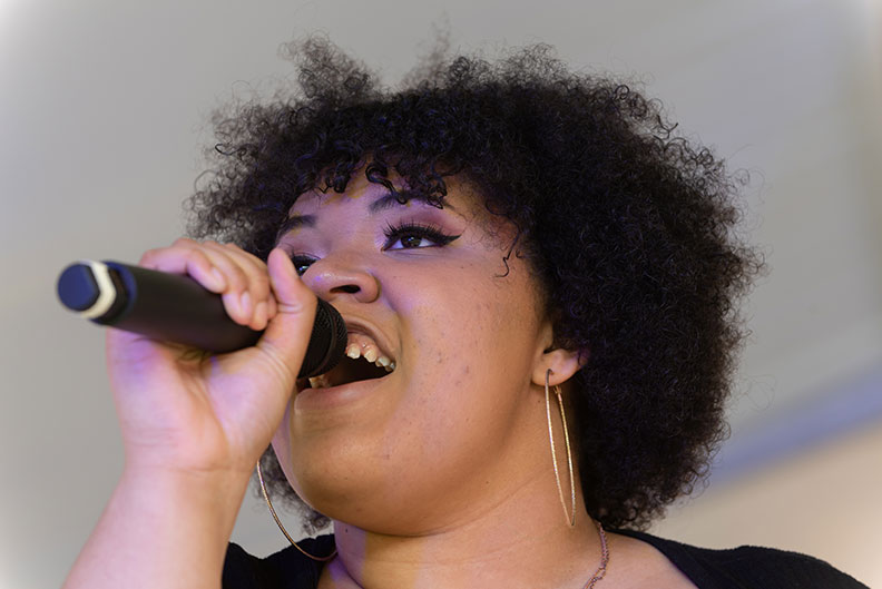 A woman singer performs during Elmhurst University's annual June Jazz outdoor concert.