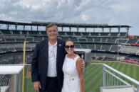 Elmhurst University President Troy D. VanAken and Dr. Annette VanAken at a baseball game in Atlanta for the 2021 President's Road Trip.