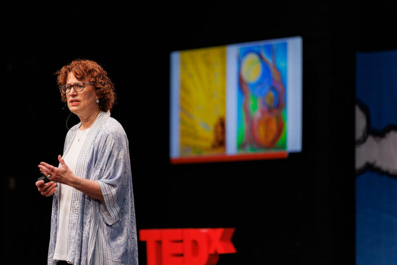 Susan Frick speaks onstage during the inaugural TedxElmhurstUniversity event.