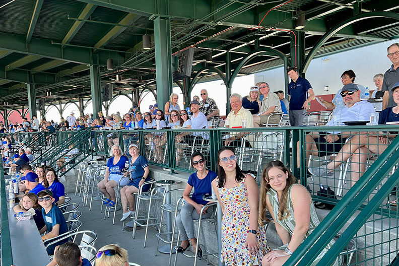 A group of Elmhurst University alumni at the Mesa, AZ, President's Road Trip spring training baseball event.