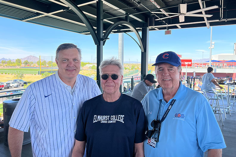 Elmhurst University President Troy D. VanAken, left, and alumni at the Mesa, AZ, President's Road Trip event.