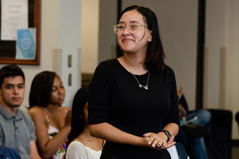 An Elmhurst University student stands to be recognized during the 2022 Student Leadership Awards.