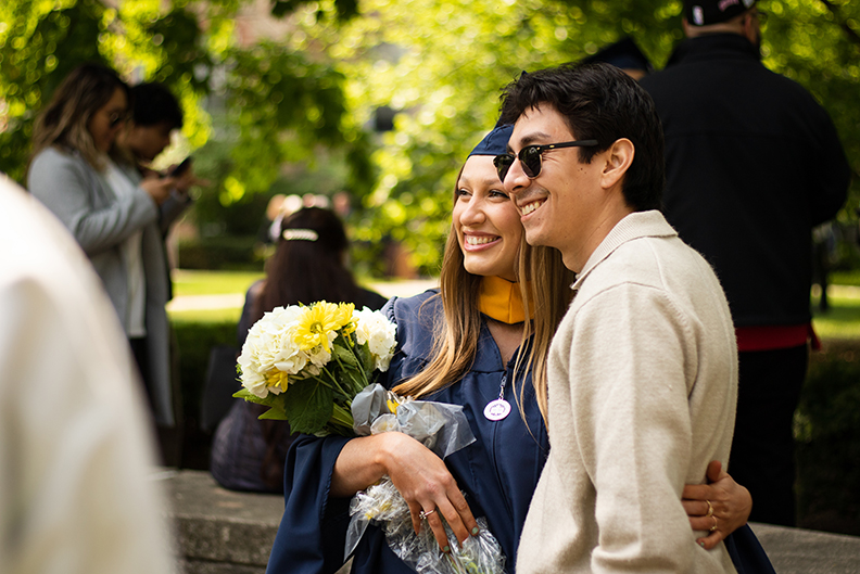 An Elmhurst University graduate with a family member