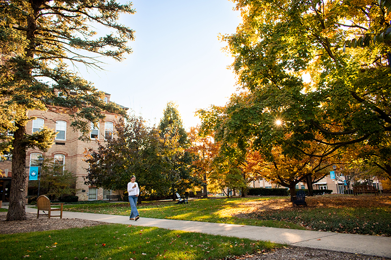 Student walking across the campus