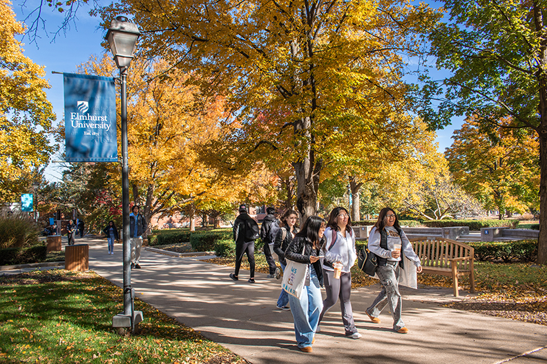 Fall trees and students walking